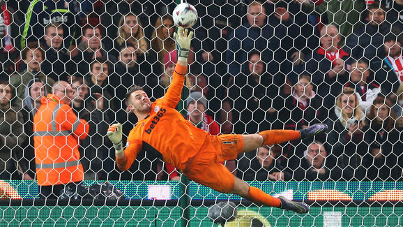 STOKE ON TRENT, ENGLAND - OCTOBER 27: Jack Butland of Stoke City saves the penalty from Eden Hazard of Chelsea to win the match during the Capital One Cup Fourth Round match between Stoke City and Chelsea at Britannia Stadium on October 27, 2015 in Stoke on Trent, England. (Photo by Catherine Ivill - AMA/Getty Images)