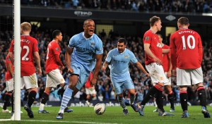 Manchester City's Vincent Kompany celebrates scoring his teams first goal during the Barclays Premier League match at the Etihad Stadium, Manchester.